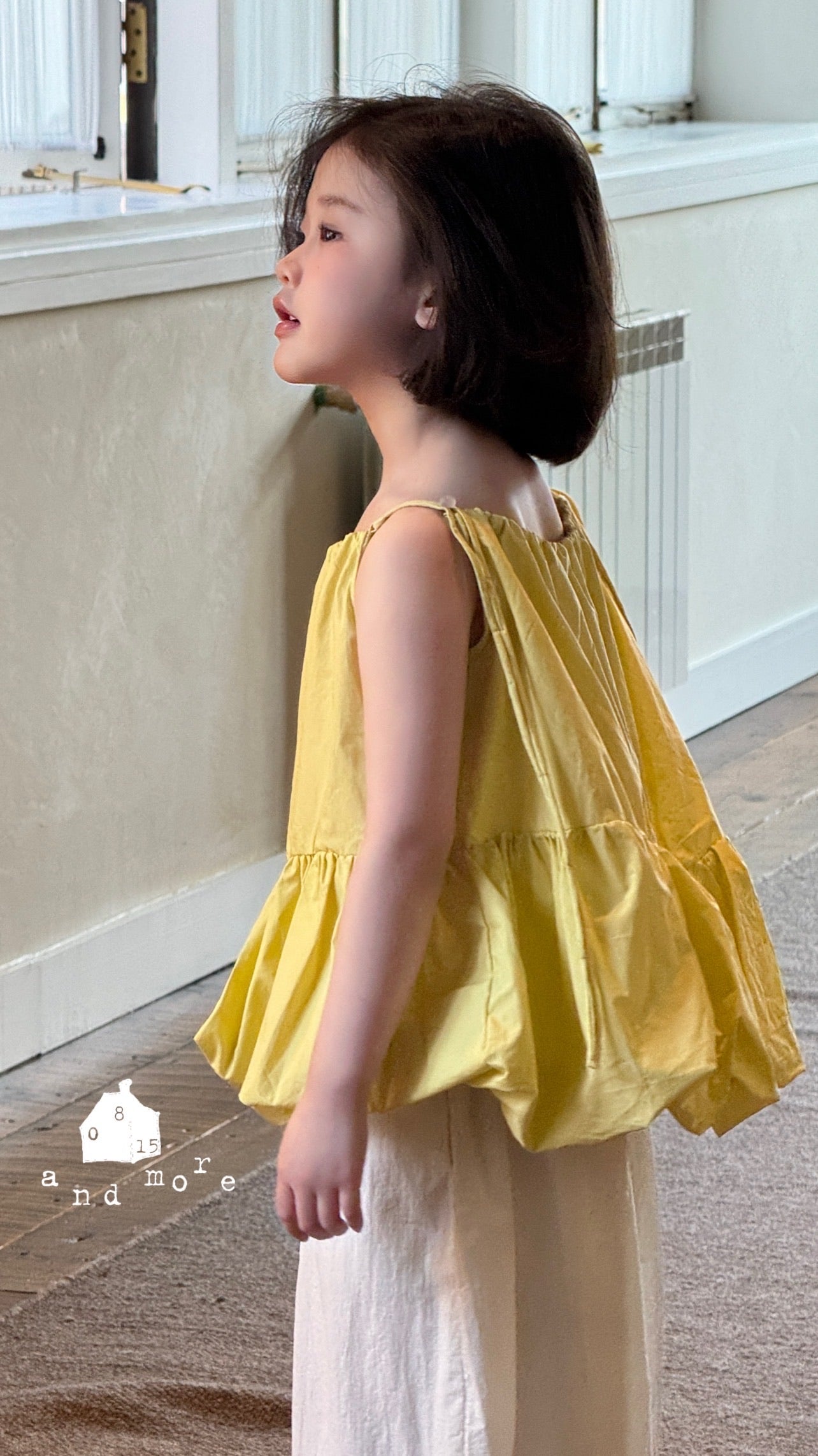 黃色吊帶花苞上衣