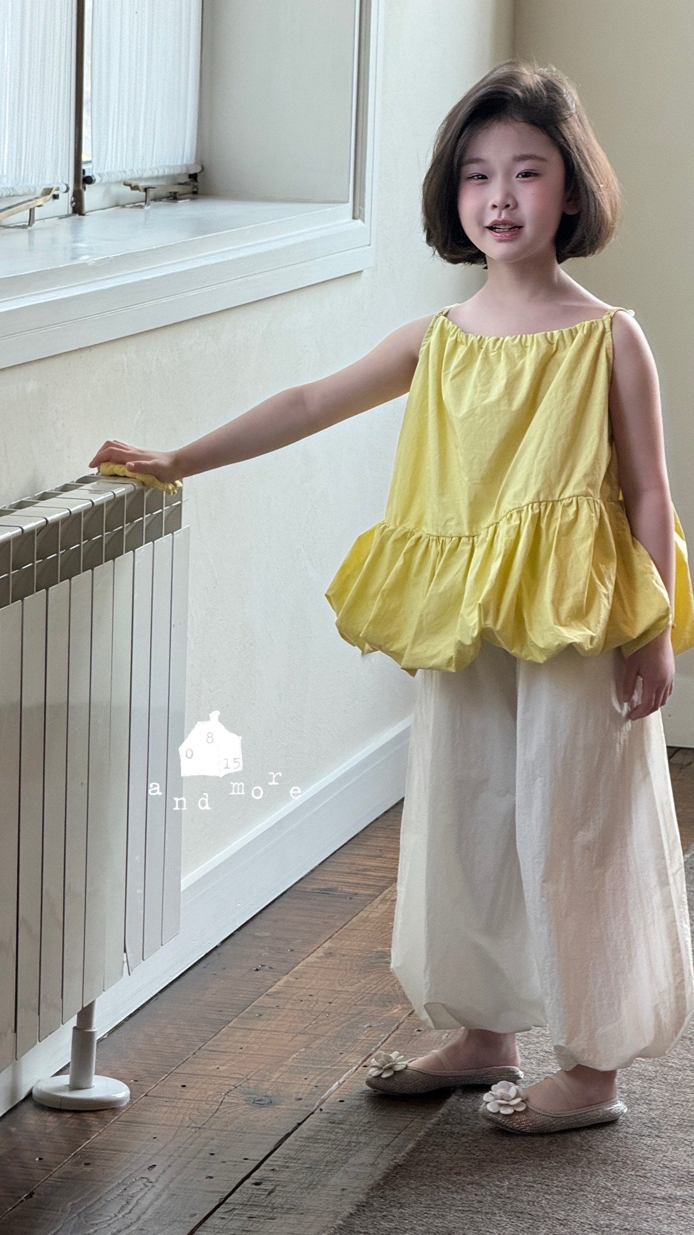 黃色吊帶花苞上衣