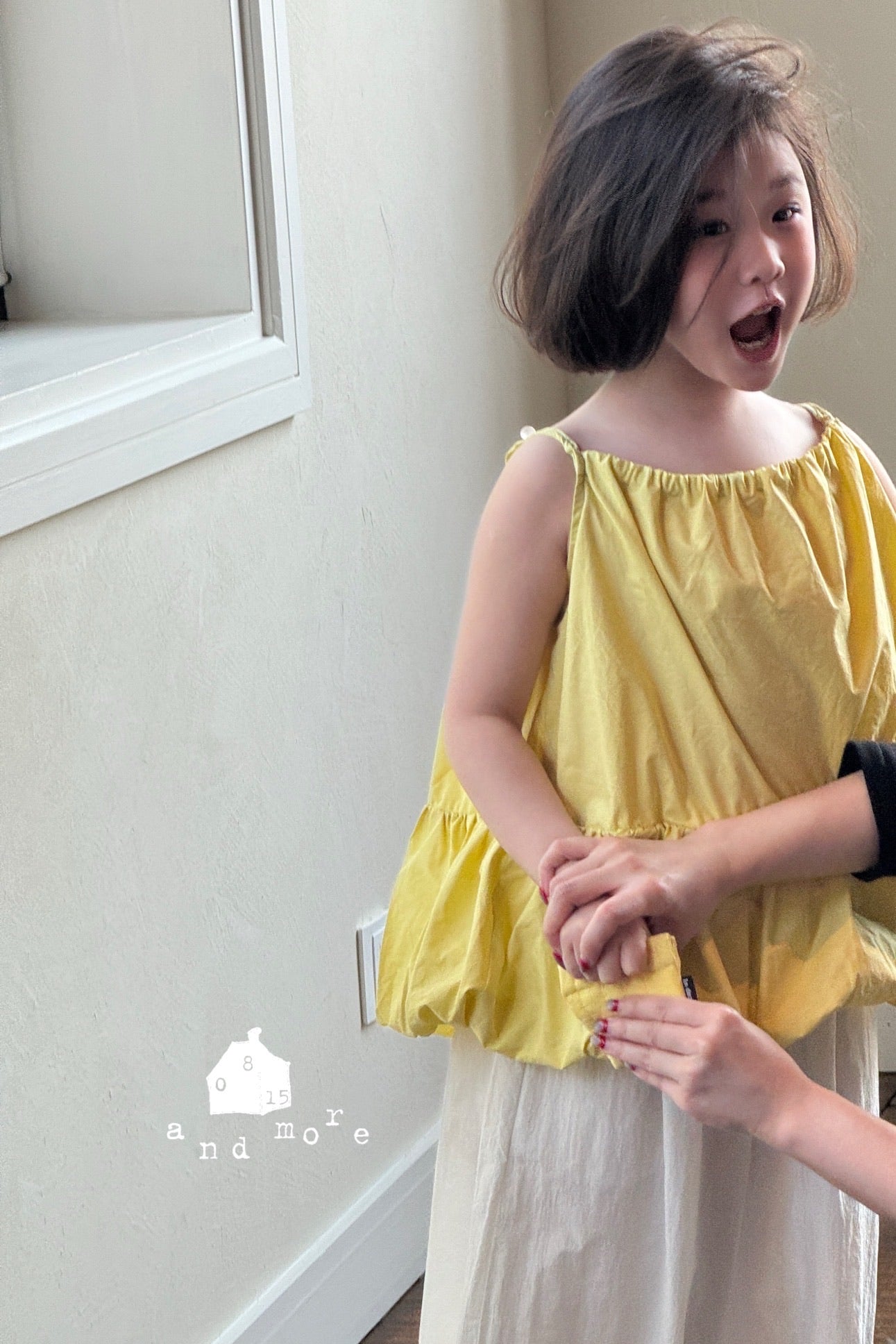 黃色吊帶花苞上衣